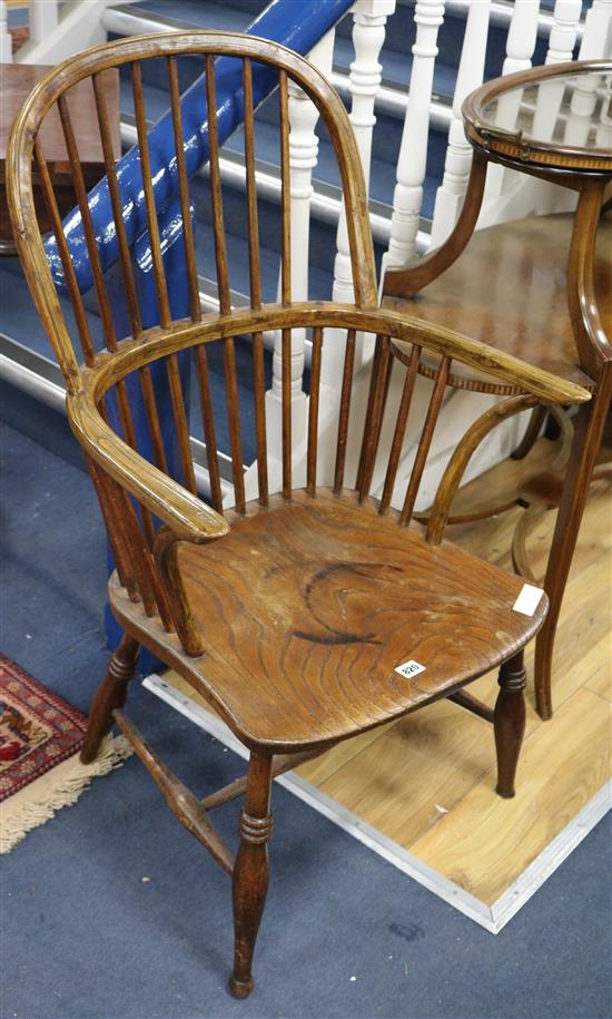 An early 19th century elm and ash stickback kitchen elbow chair (cut down)